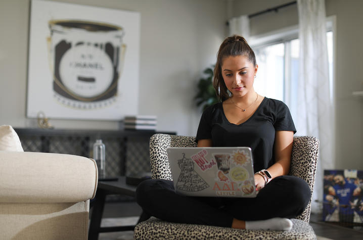 Girl working on computer. 