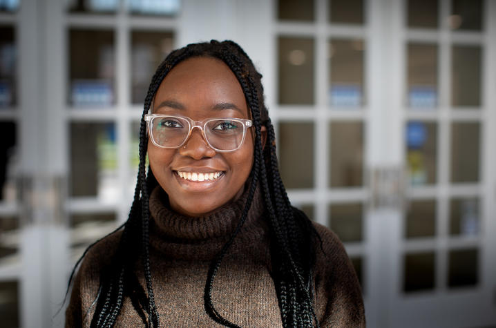 photo of Chimene Ntakarutimana outside Young Library doors