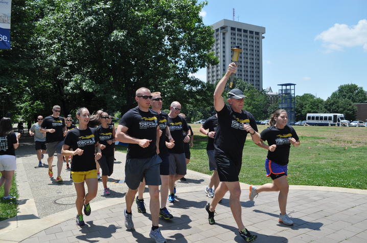 photo of UK Police officers running in Law Enforcement Torch Run in 2014