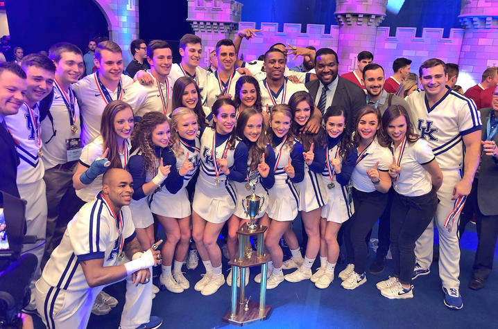 photo of 2018 UK Cheerleaders with UCA trophy