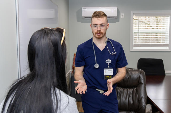 Bradley talking to a CATS Clinic patient