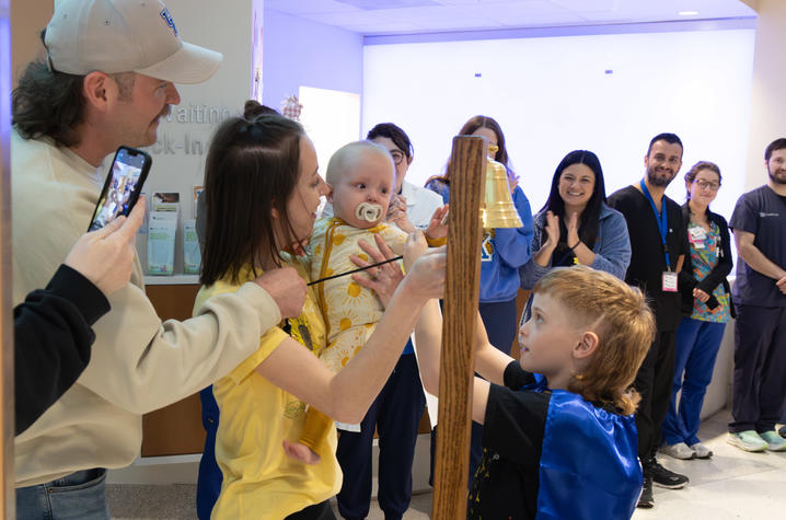 Image of Addi ringing a bell in the NICU