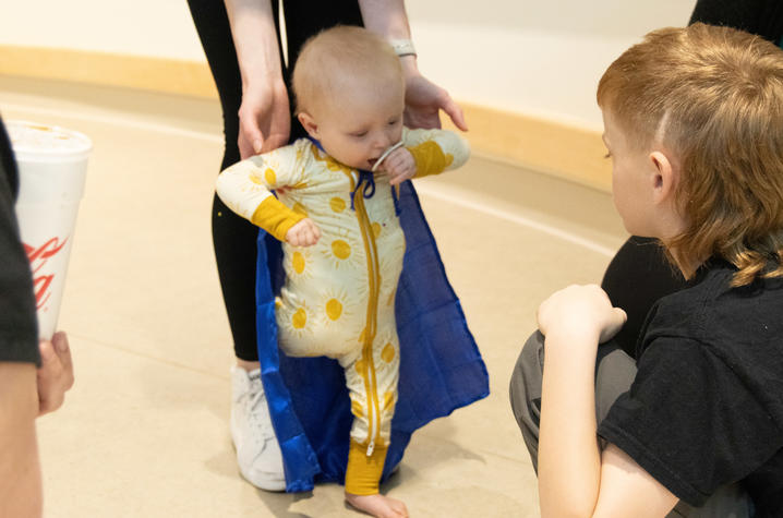 Image of Addi standing in front of her brother