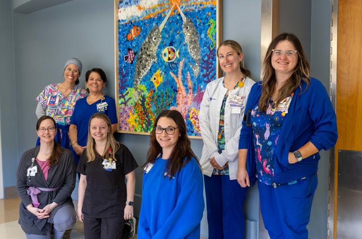 group of nurses by the finished art piece