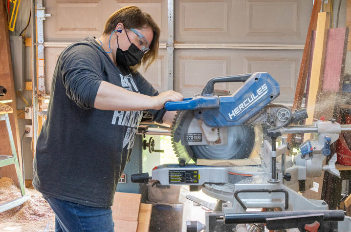 Rhea doesn't let anything stop her. Instead she learned new ways to adapt to doing the things she loves, like cutting wood for her next design. Hilary Brown | UK Public Relations