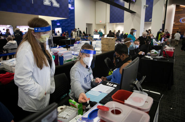 Photo of volunteers working at COVID-19 vaccine clinic at Kroger Field