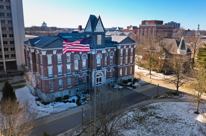 photo of UK Main Building with flag