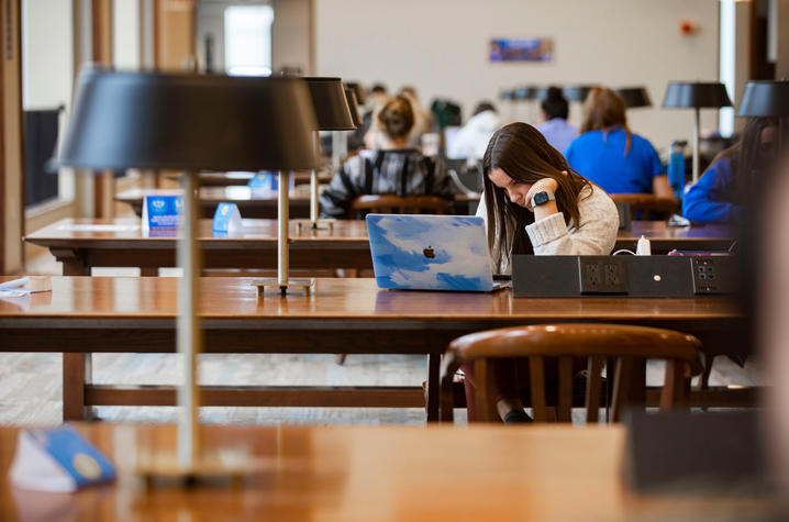 Student studying inside William T. Young Library