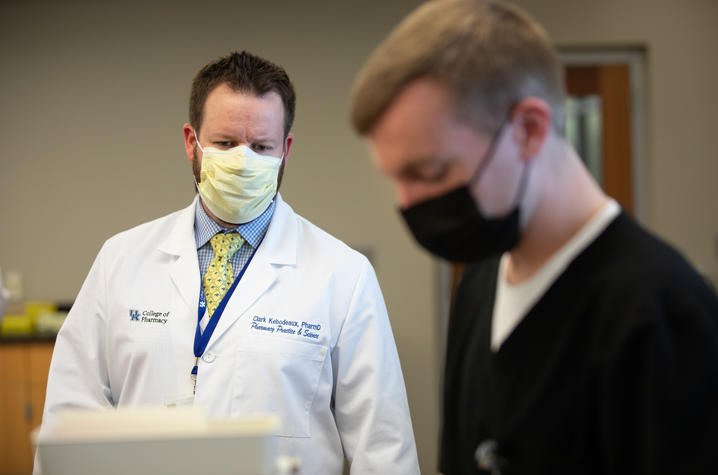 Pharmacy professor Clark Kebodeaux works with his students in the lab on March 4, 2021. Mark Cornelison | UK Photo