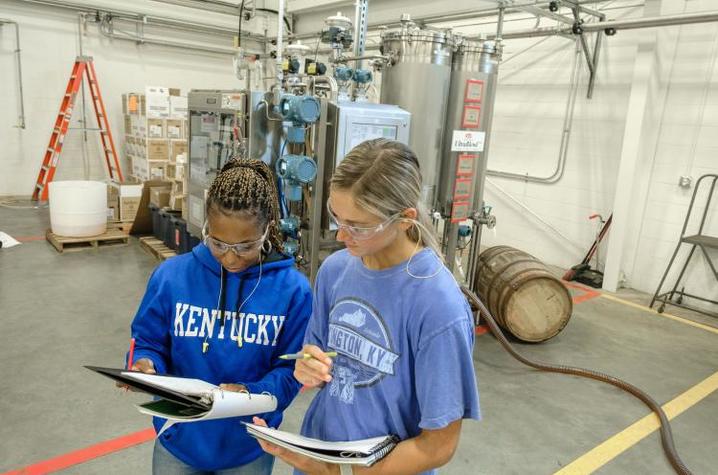 UK Distillation, Wine and Brewing Studies students Johnna Campbell and Riley Neill study their notes on the UltraBlend™ system. Photo by Matt Barton