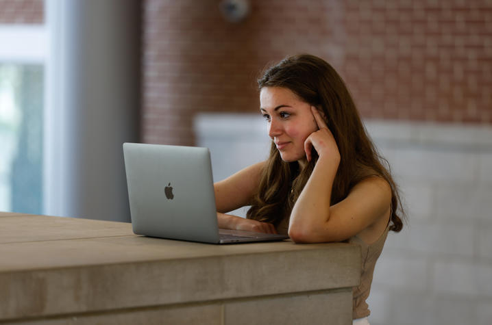 Girl working on her laptop.