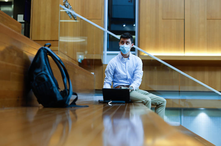 Male student working on computer.