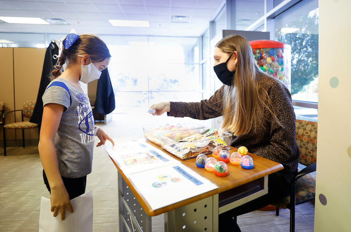 image of young girl choosing a reward