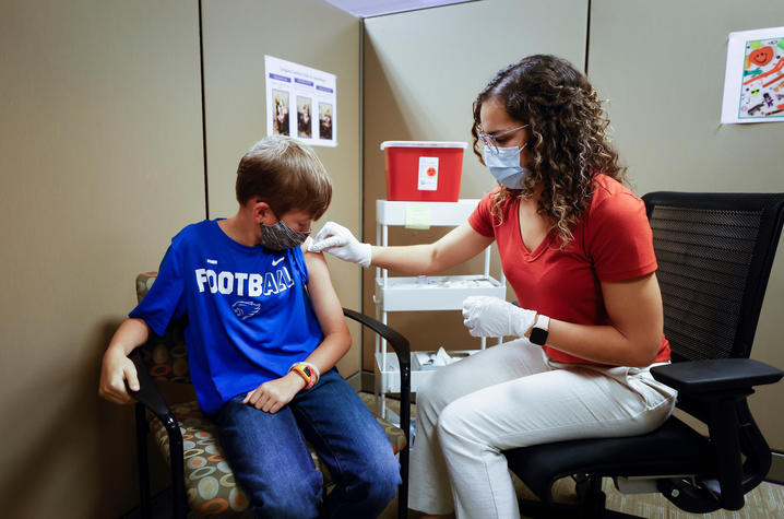 image of young boy in private vaccine area