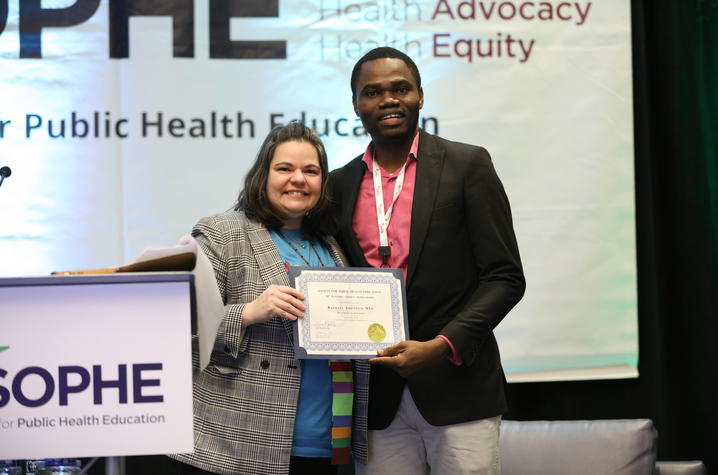 Raphael Adesiyan accepts a 21st Century student scholarship award at the Society of Public Health Education annual conference. Photo submitted. 