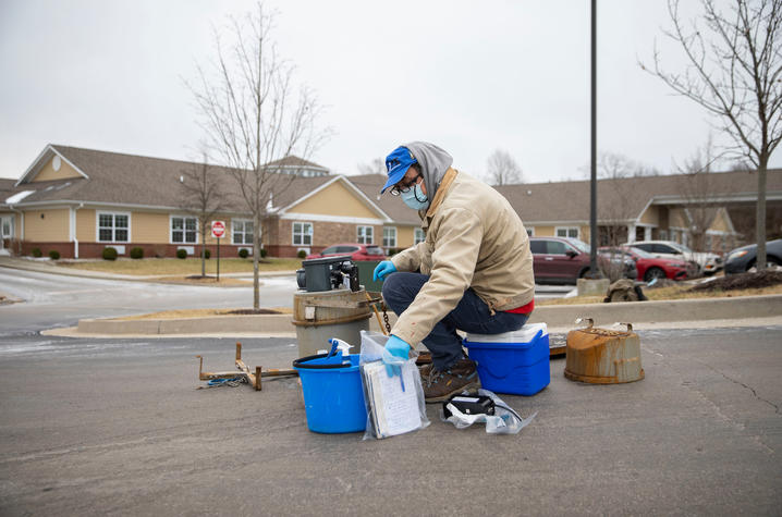 UK researcher Blazan Mijatovic collects wastewater samples from a nursing home in Lexington. Pete Comparoni | UK Photo