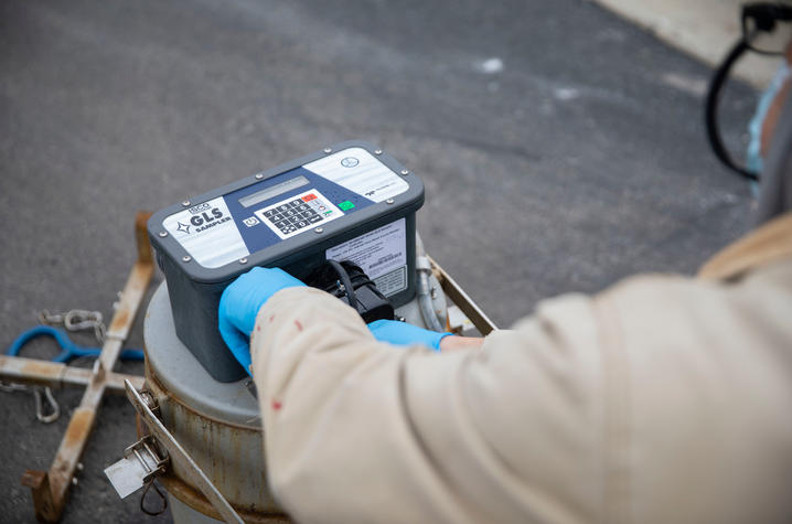 UK researcher Blazan Mijatovic collects wastewater samples from a nursing home in Lexington. Pete Comparoni | UK Photo