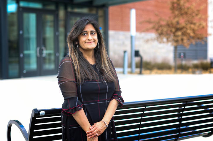 Eman Sheikh standing on campus. 