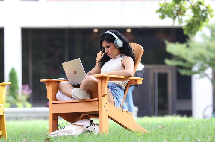 girl sitting using laptop. 