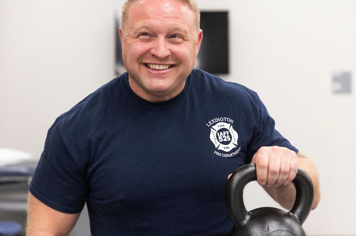 firefighter alex jann smiling during physical therapy