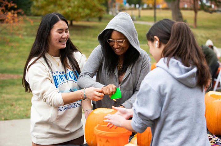 photo of students carving pumpkins