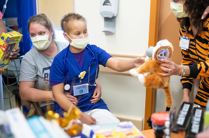 image of patient dressed as a doctor getting treats