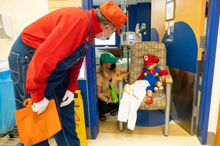 image of Dr. Newman interacting with patient dressed as Mario