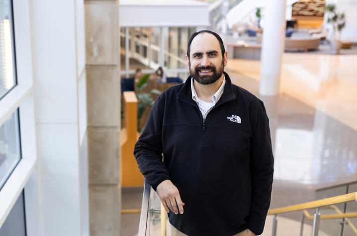 image of Chip Hunter wearing a black pullover, standing on the stairs in UK HealthCare's Chandler Hospital.