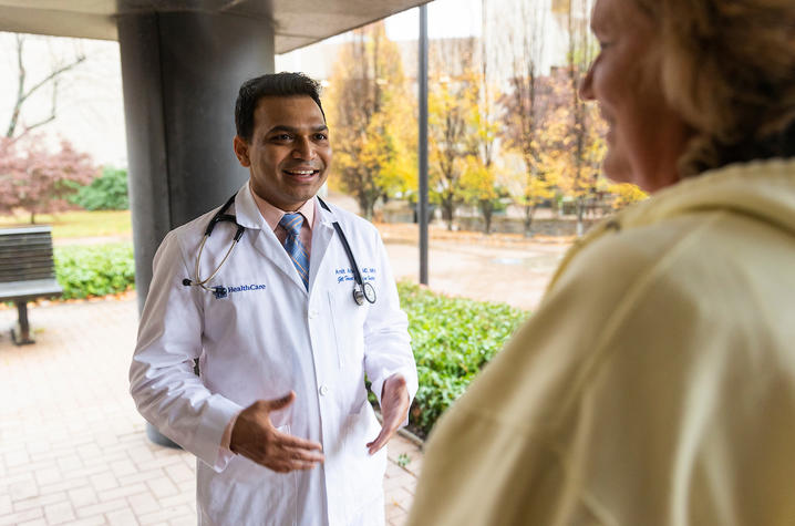 Image of Dr. Amit Arbune chatting with Barbie Johnson