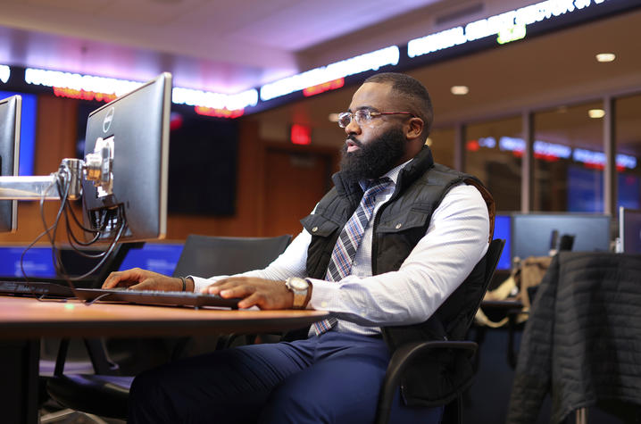 Man working at a computer. 