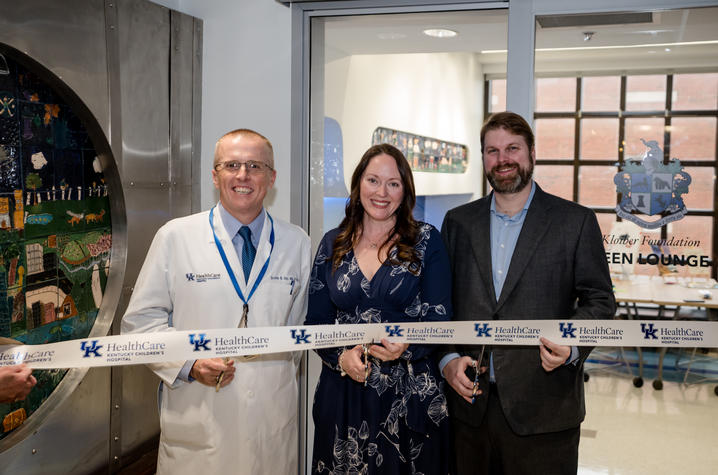 Image of Dr. Day and the Kloibers cutting the ribbon to the new teen room