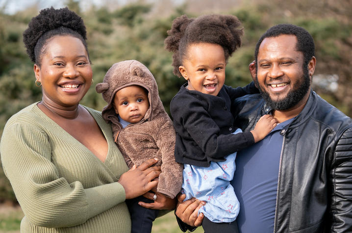 image of Nwoguh family smiling in the park