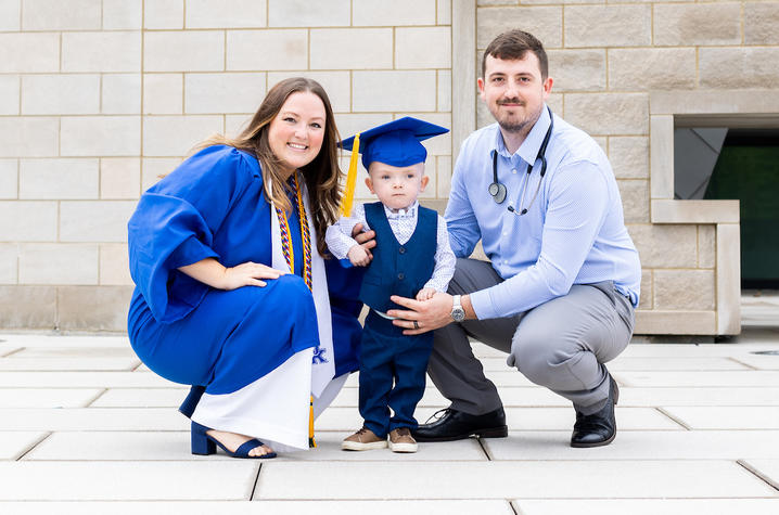 Graduating senior Elizabeth Buckles pictured with her son TJ and husband Tylor