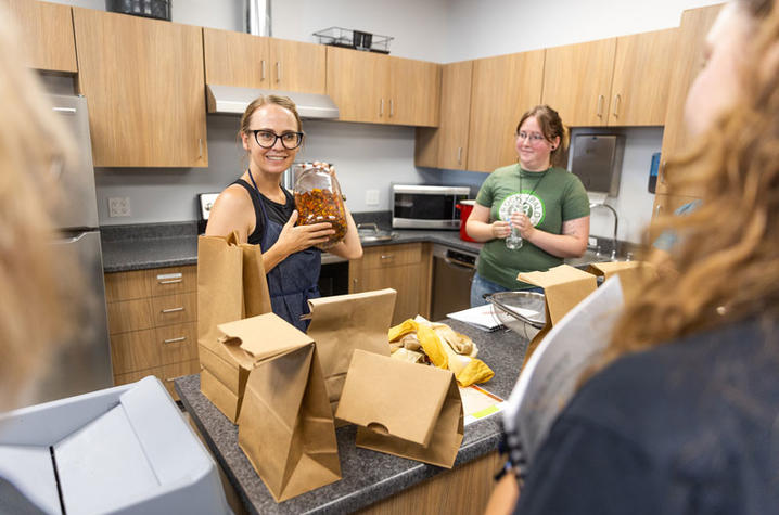 Professor showing dried flowers to students