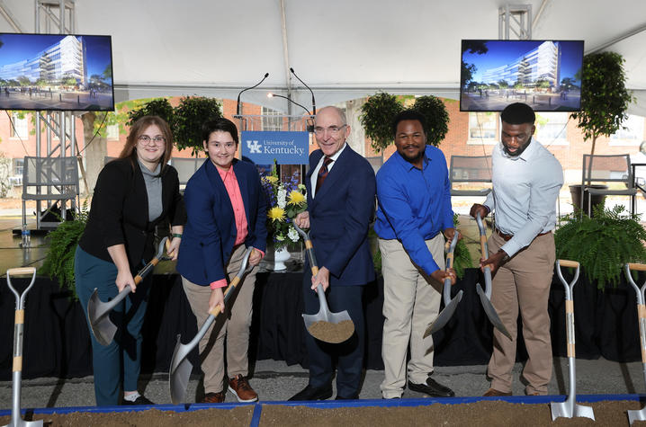 Four health colleges students with UK President Eli Capilouto