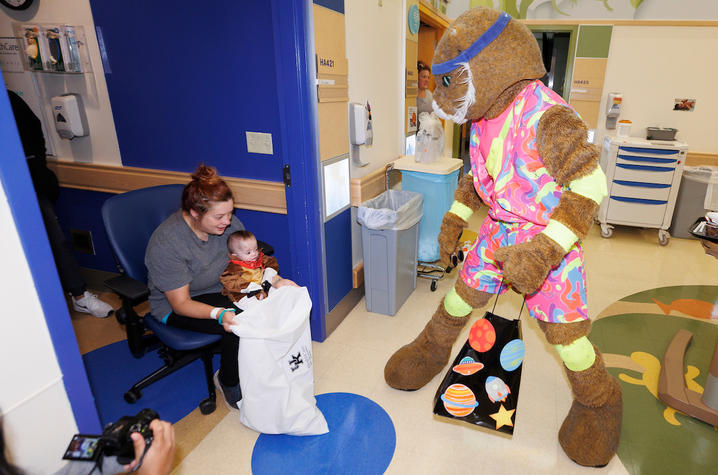 image of baby cowboy and mom meeting Wildcat