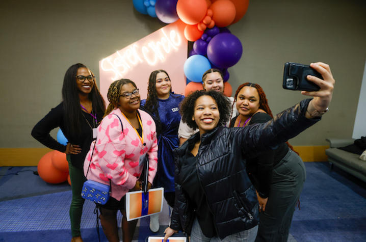 Photo of girls taking selfie. 