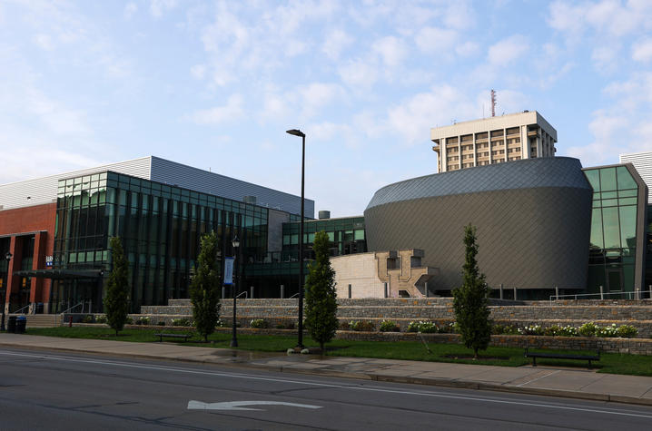 The UK Gatton Student Center view from the sidewalk with the Patterson Office Tower behind it. 