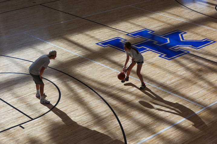 Photo of Two People Playing Basketball