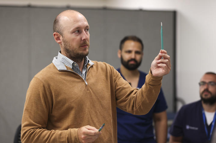 Blake Davidson, M.D., explains the purpose of different scalpels. Carter Skaggs | UK Photo