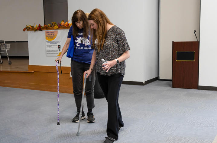 Two women holding canes