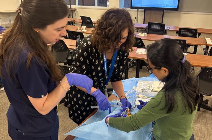 Image of providers engaging in a medical simulation