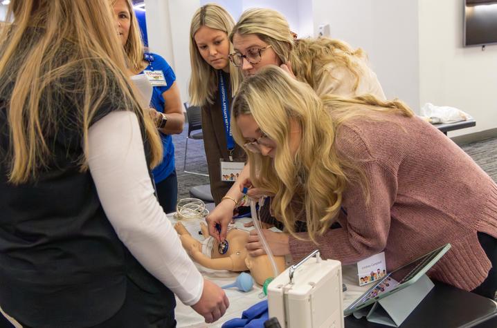 Image of providers engaging in a medical simulation