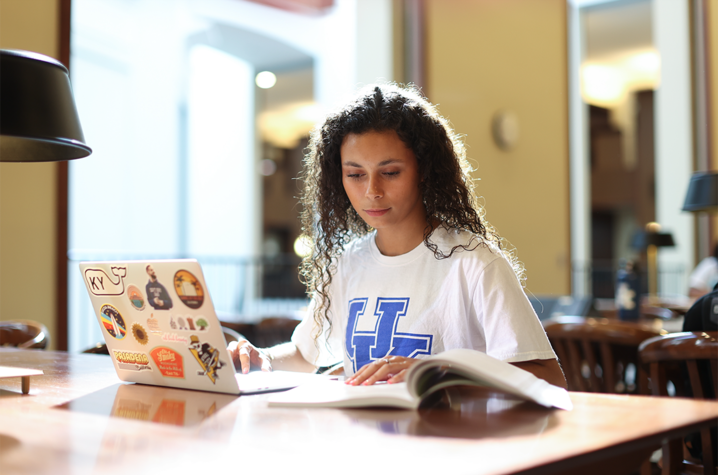 Student studying inside William T. Young Library