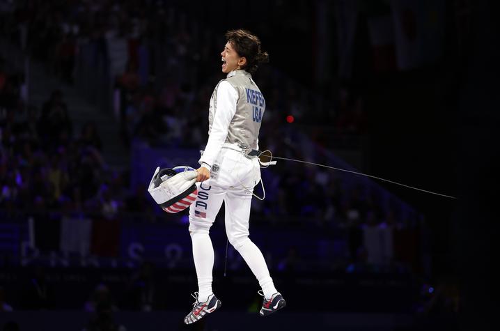 Lee Kiefer became a three-time gold medalist, repeating as gold medalist in women’s foil individual gold and winning another team gold. Photo by Getty Images.