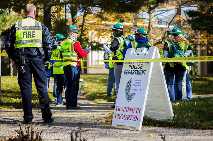 UK Police to host training UKPD to host training. Image of police and fire in yellow vests conducting a training outside.