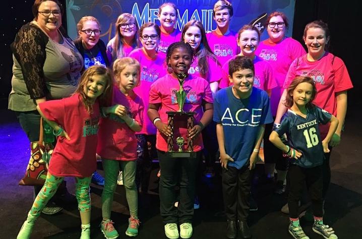 photo of ACE students with Excellence in Ensemble Work Award at Junior Theater Festival