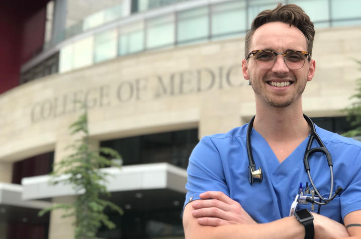 Aaron Gillette in front of the University of Oklahoma College of Medicine