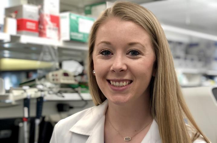 photo of Ashley Taylor Stevens in labcoat in lab