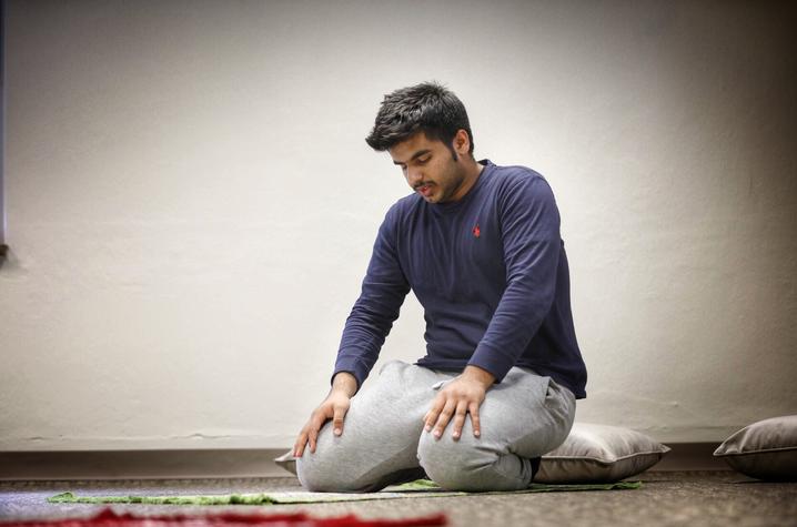 UK freshman Yousuf Al Mamari prays in the new interfaith prayer and meditation room (Photo by Mark Cornelison, UK Photographer)